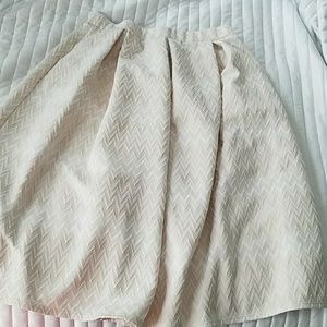cream and white skirt with pleats